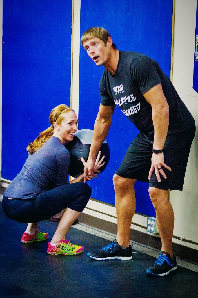 Dai coaching one of the group in the gym